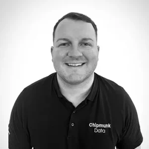 Comp Cloud – About Us5 Professional headshot man black polo shirt Chipmunk Data