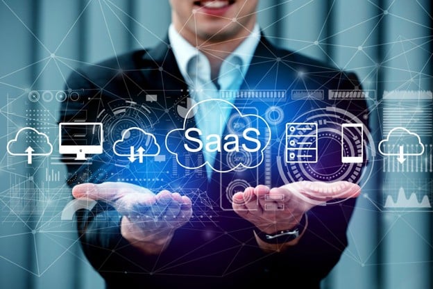 Businessman displaying SaaS technology icons and digital network